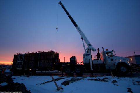 Unloading housing forms at the break of dawn on a 18 Ton